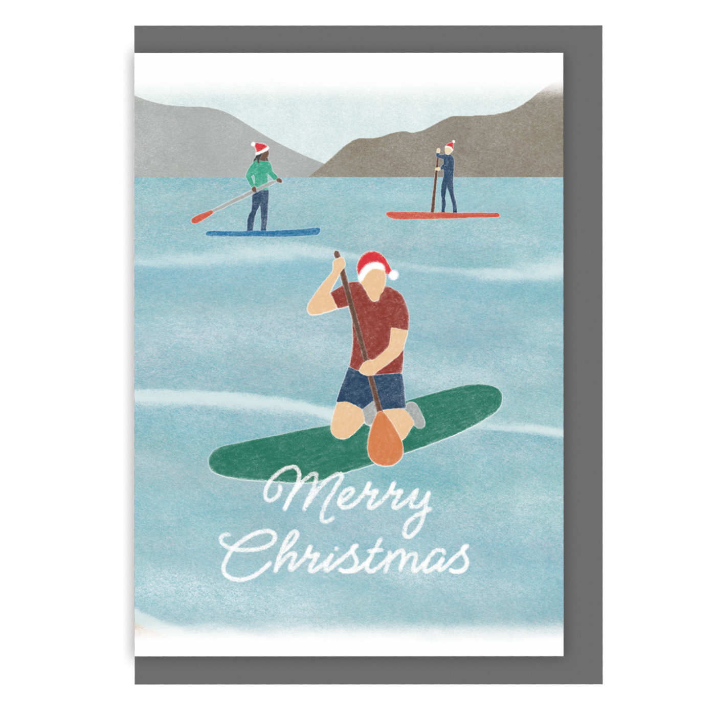 Paddle boarding Christmas card with three paddleboarders wearing Santa hats and the message "Merry Christmas" on a white background