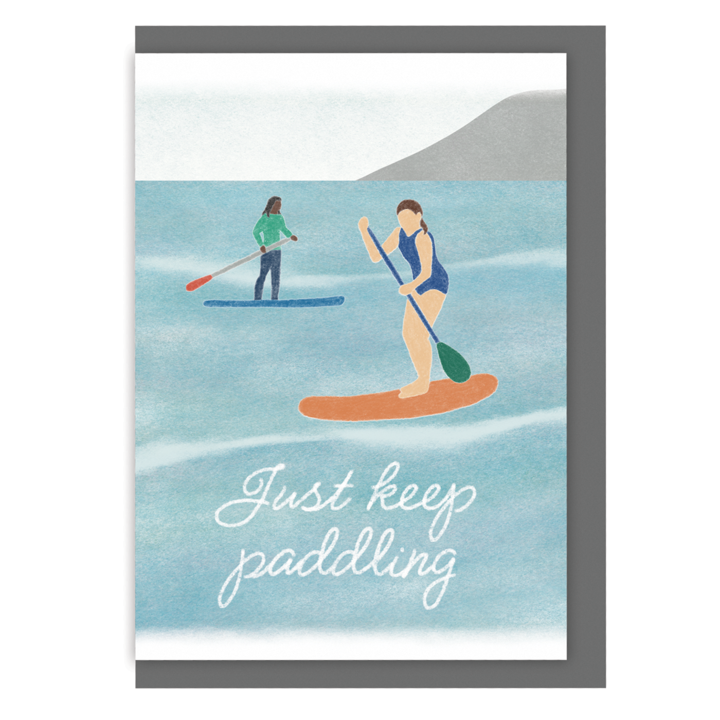 A6 greetings card with an illustration of two people paddleboarding, with the text 'Just keep paddling' written over the water at the bottom