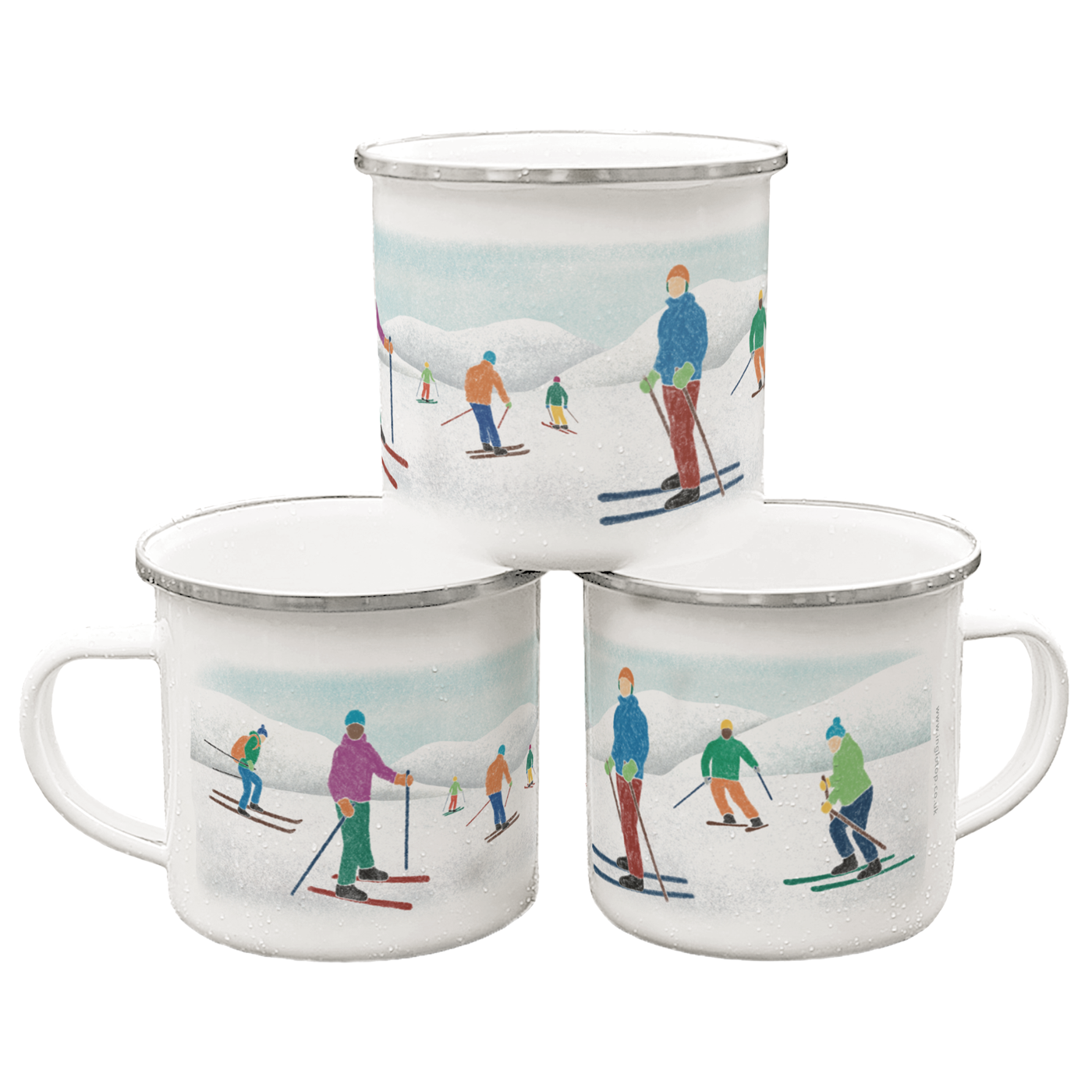 A stack of three enamel mugs printed with illustrations of skiers on a white background