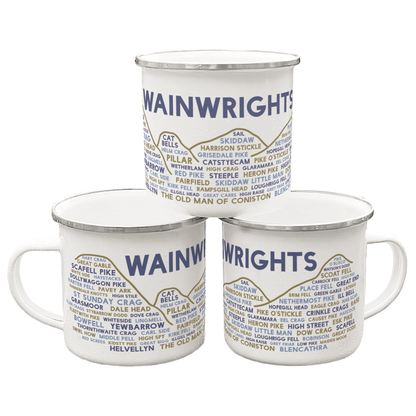 Three stacked white enamel mugs with silver rims, on a white background. Each mug features the word "Wainwrights" in purple, with the names of various Lake District fells underneath it.
