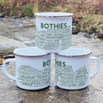 Stack of Bothies enamel mugs outdoors